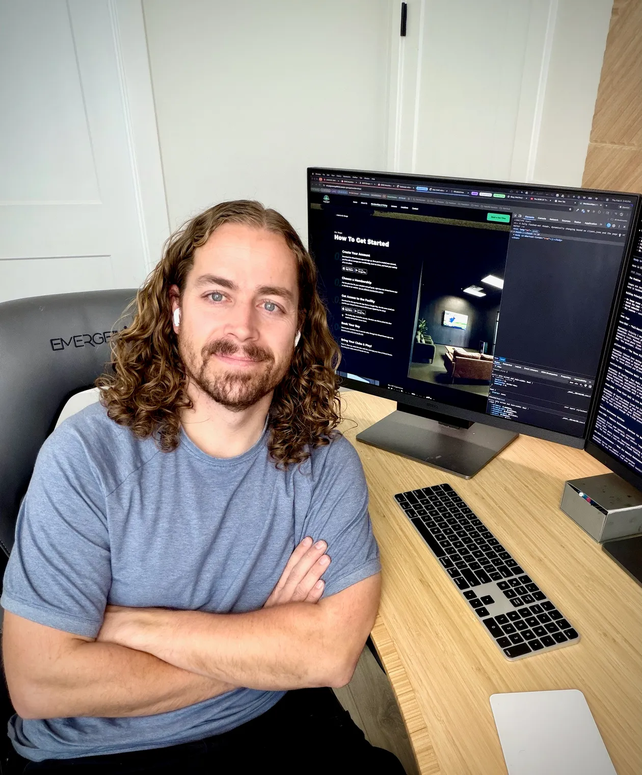 Max Jacobson, founder of Red Rock Web Design, at his workstation with code on dual monitors